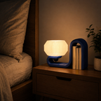 bookworm lamp on bedside table magenta